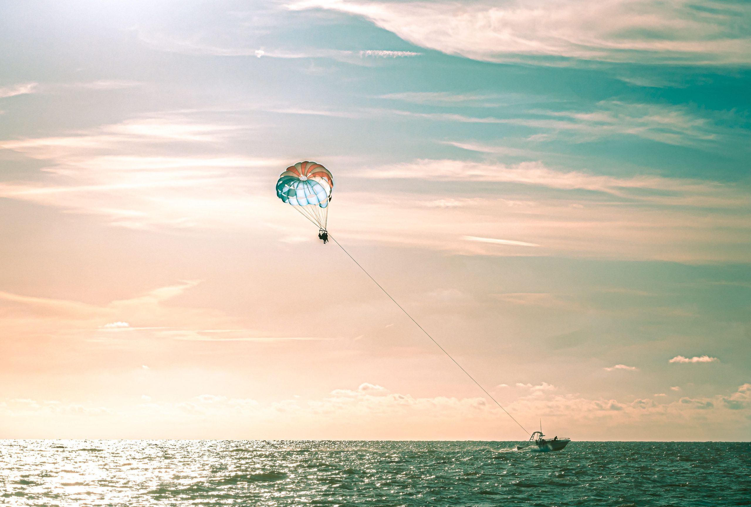 City of Clearwater sunset at the beach with parasailing.
