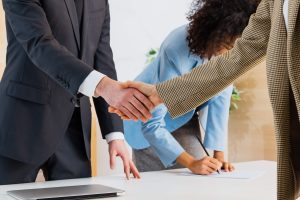 Business Hand Shake between Faith Based Operations and HQE Systems for their integration of threat management.